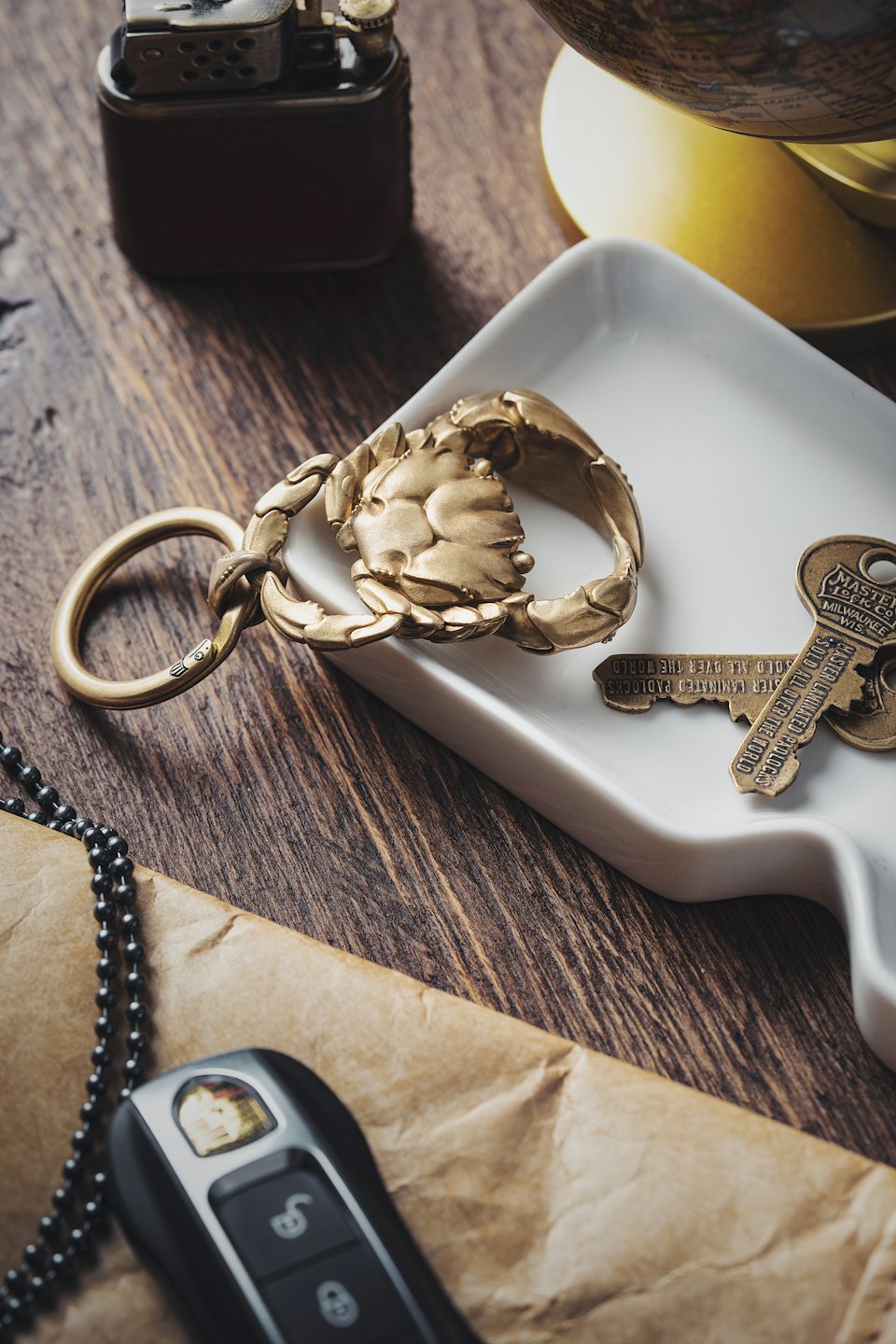 Assorted personal items arranged on a wooden table.